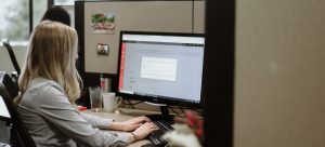 Glypher working at their desk answering client questions about how to translate WordPress site